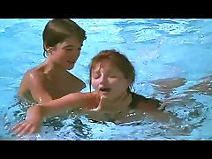 Attractive young boy with mature in swimming pool